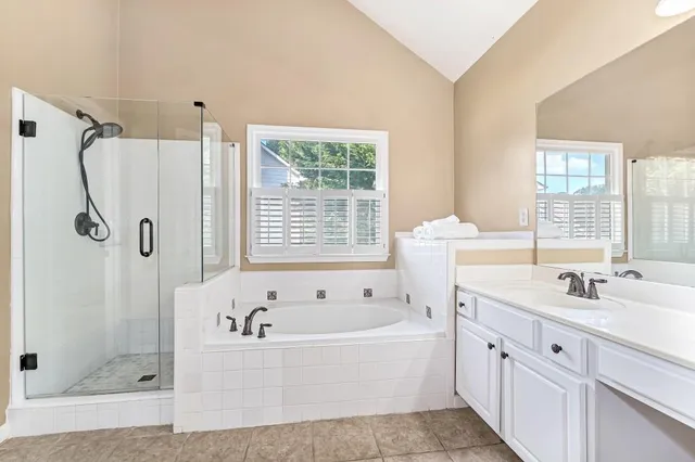 a bathroom with a bathtub and a sink