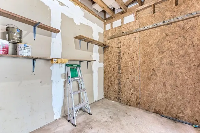 a view of a house with yard and sitting area