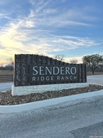 a view of a sign board with yard