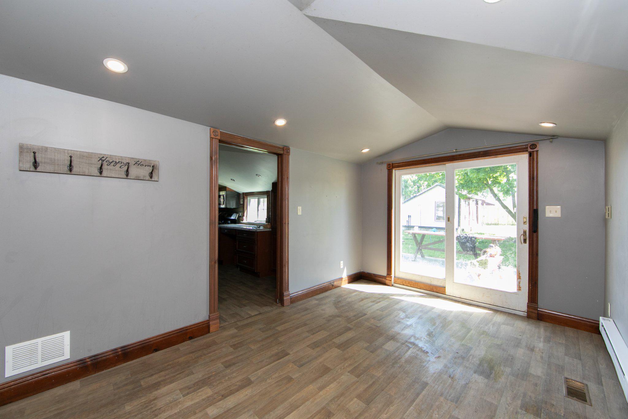 128 Jefferson Road Elmer, NJ 08318 - Photo 14 of 47 an empty room with wooden floor and windows