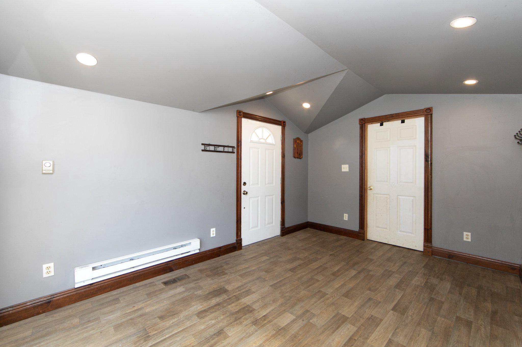 128 Jefferson Road Elmer, NJ 08318 - Photo 15 of 47 an empty room with wooden floor and windows