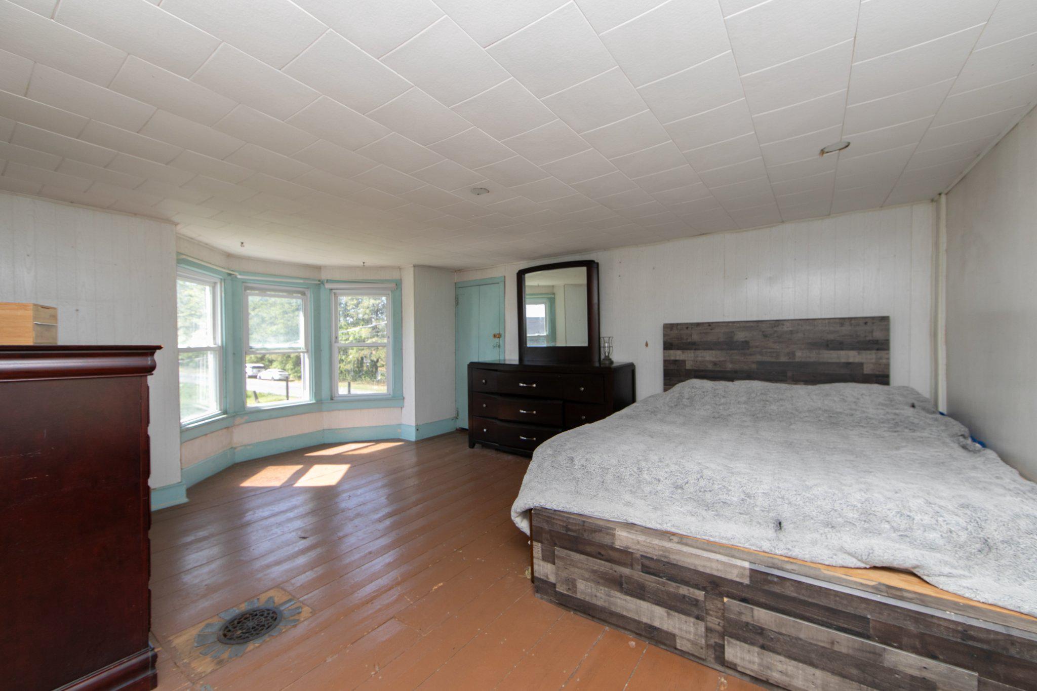 128 Jefferson Road Elmer, NJ 08318 - Photo 21 of 47 a bedroom with a bed and wooden floor