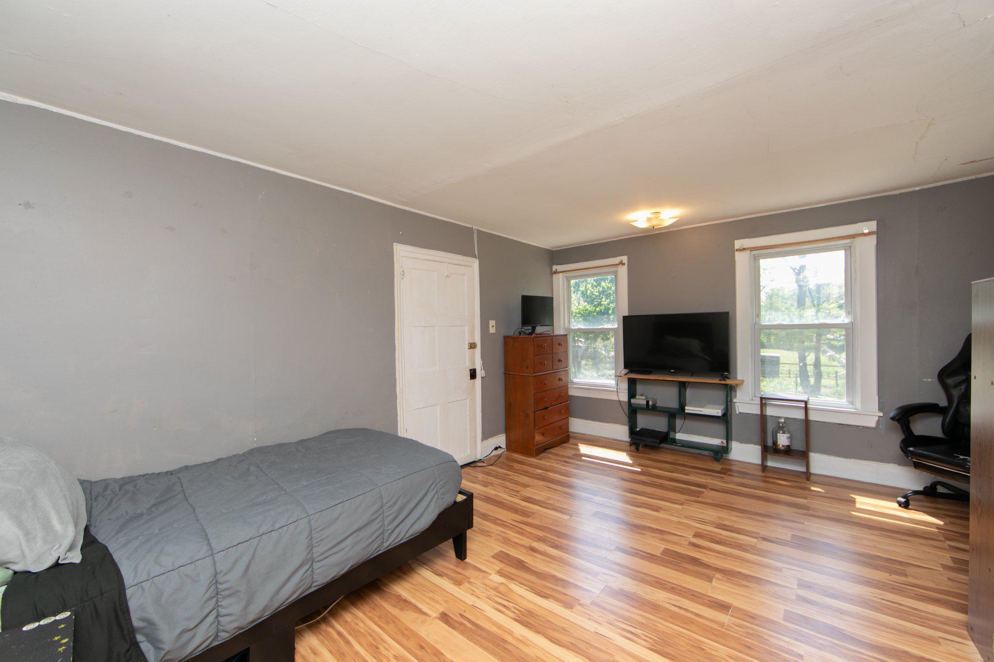 128 Jefferson Road Elmer, NJ 08318 - Photo 23 of 47 a living room with furniture a flat screen tv and a fireplace
