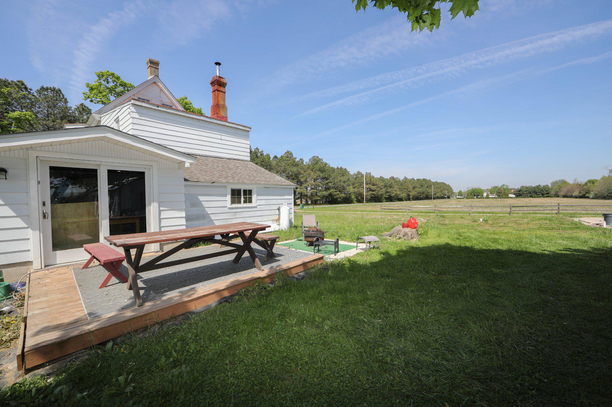 128 Jefferson Road Elmer, NJ 08318 - Photo 25 of 47 a view of a house with garden and sitting area