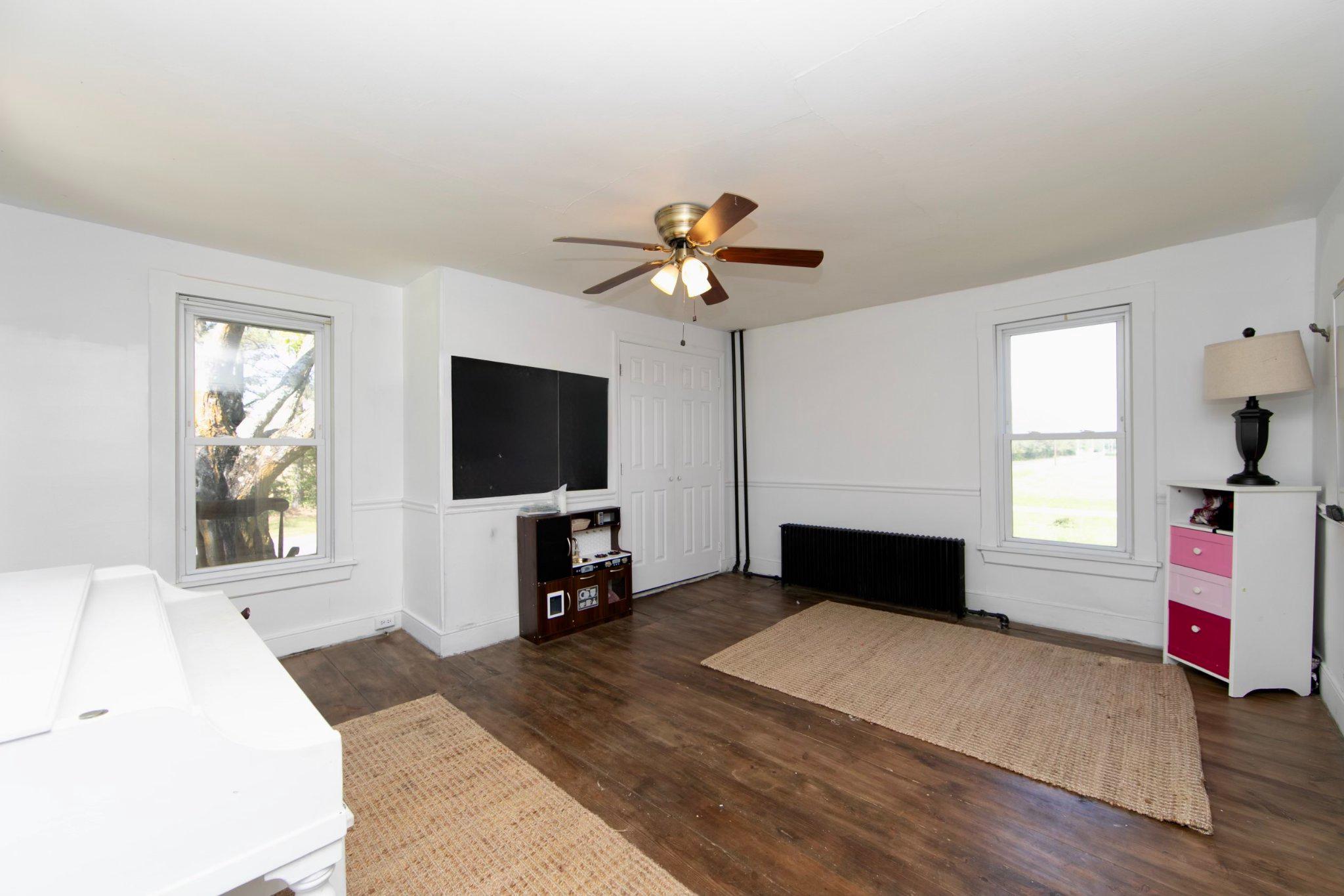 128 Jefferson Road Elmer, NJ 08318 - Photo 4 of 47 a living room with furniture and a flat screen tv