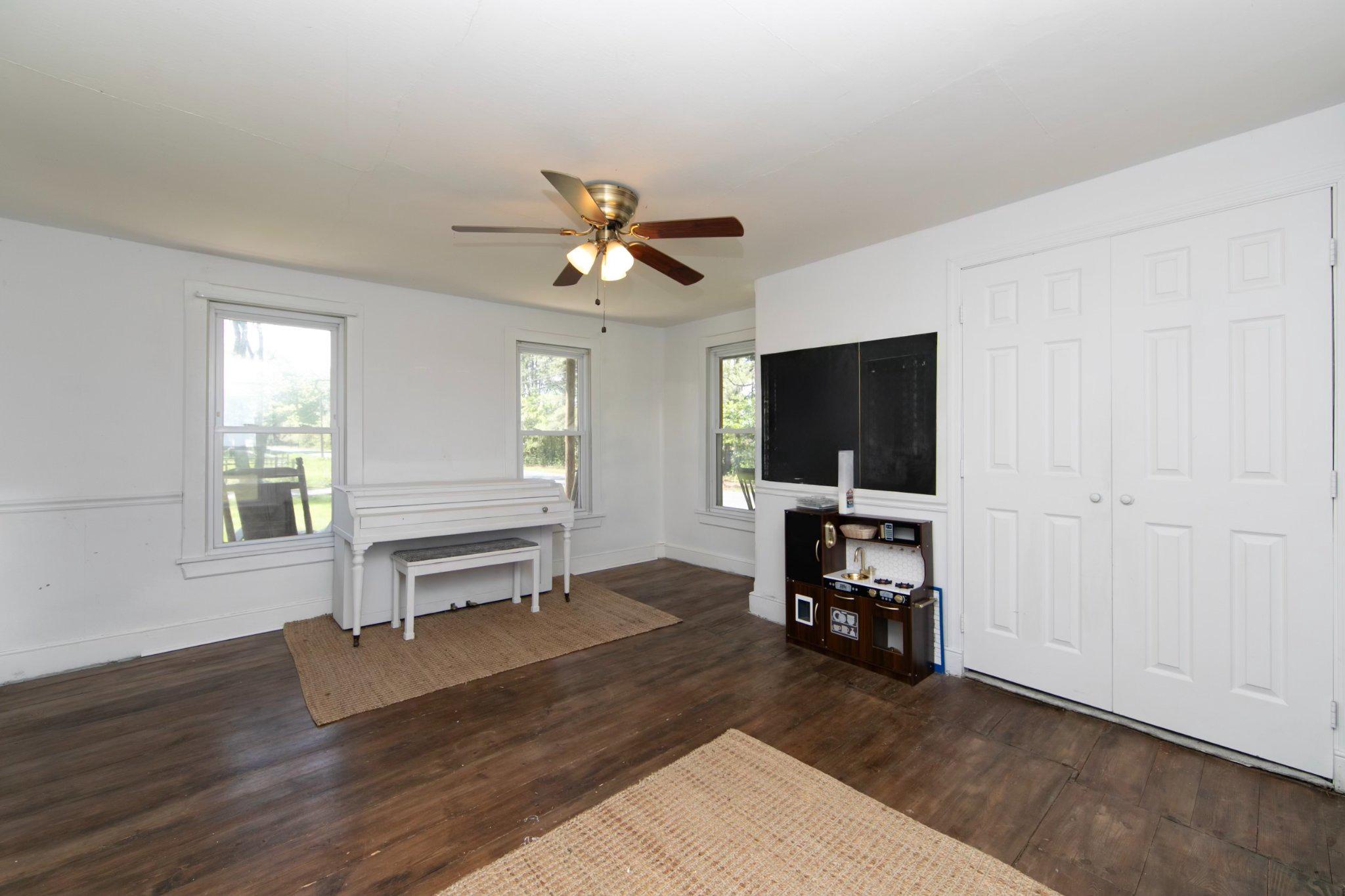128 Jefferson Road Elmer, NJ 08318 - Photo 5 of 47 a living room with furniture and a flat screen tv