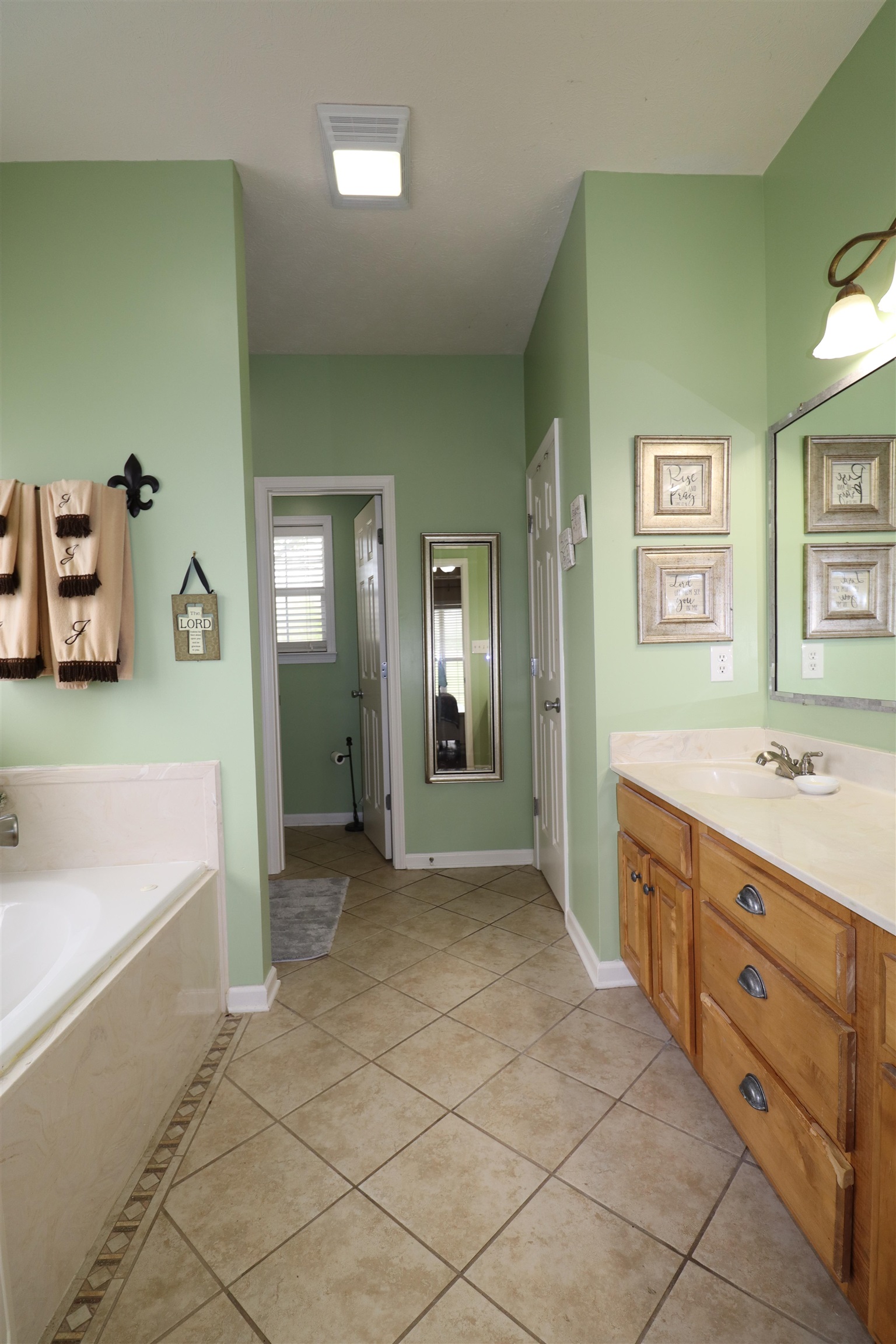 730 Durhamville Road Ripley, TN 38063 - Photo 11 of 40 a spacious bathroom with a tub sink and mirror