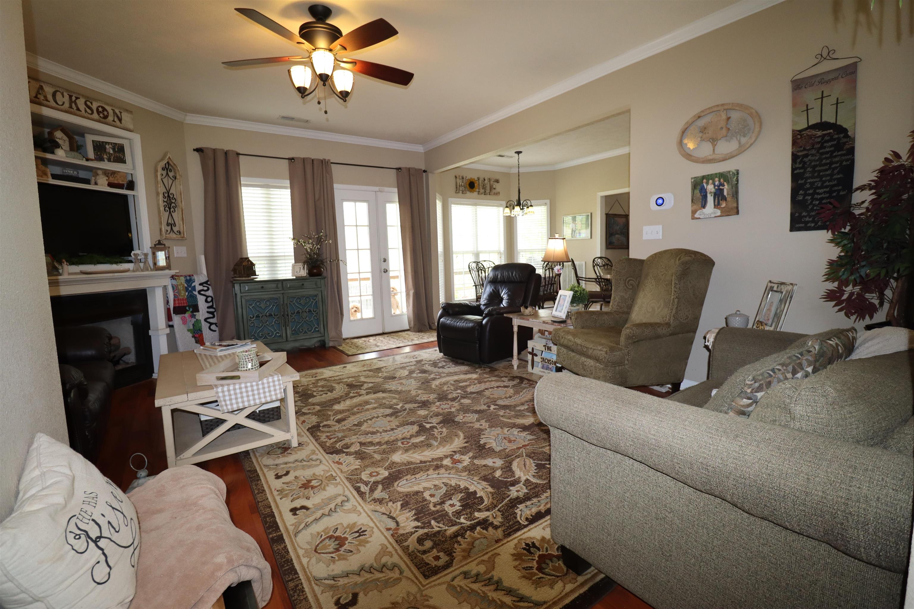 730 Durhamville Road Ripley, TN 38063 - Photo 12 of 40 a living room with furniture a flat screen tv and a window