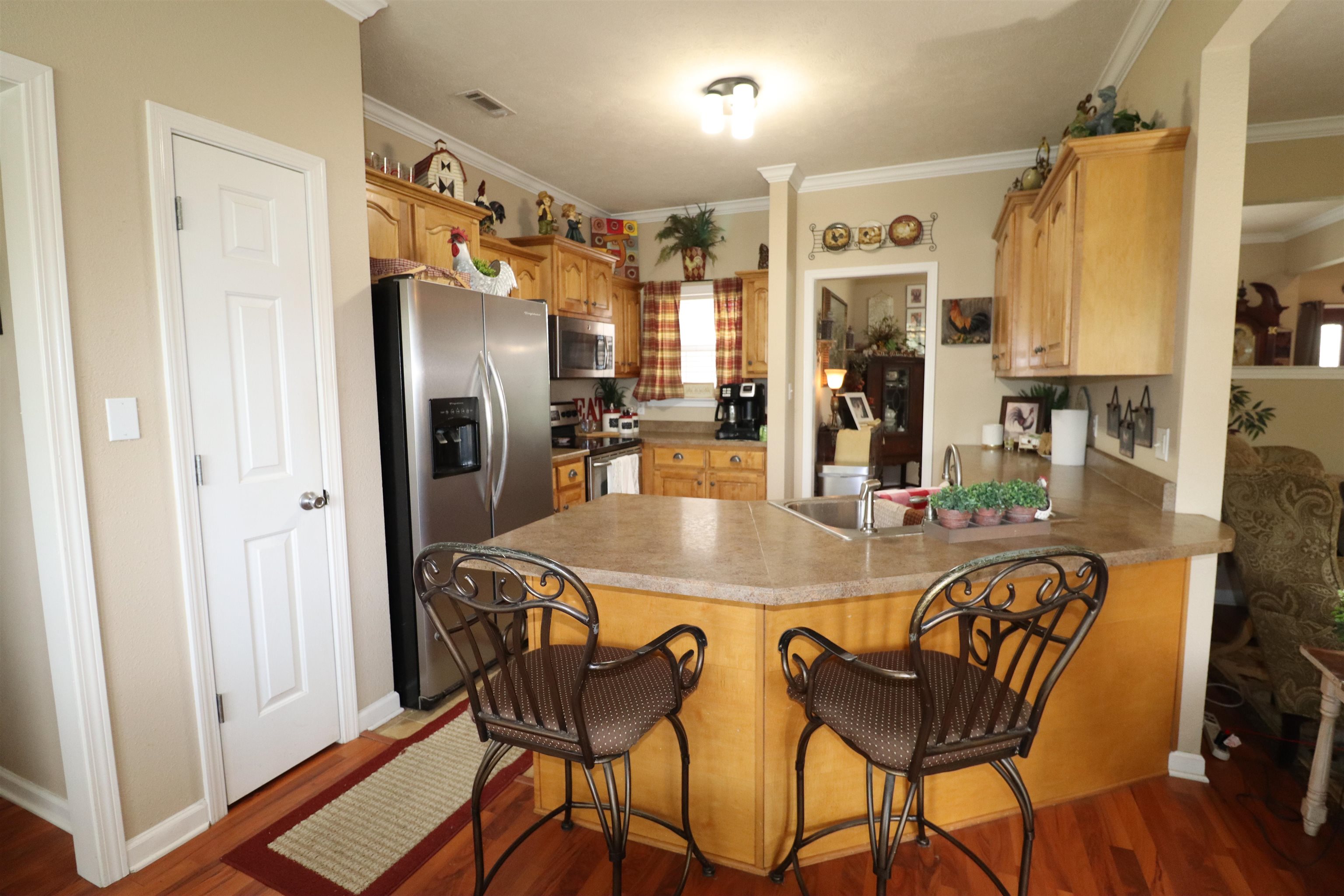 730 Durhamville Road Ripley, TN 38063 - Photo 15 of 40 a kitchen with stainless steel appliances granite countertop a dining table and chairs