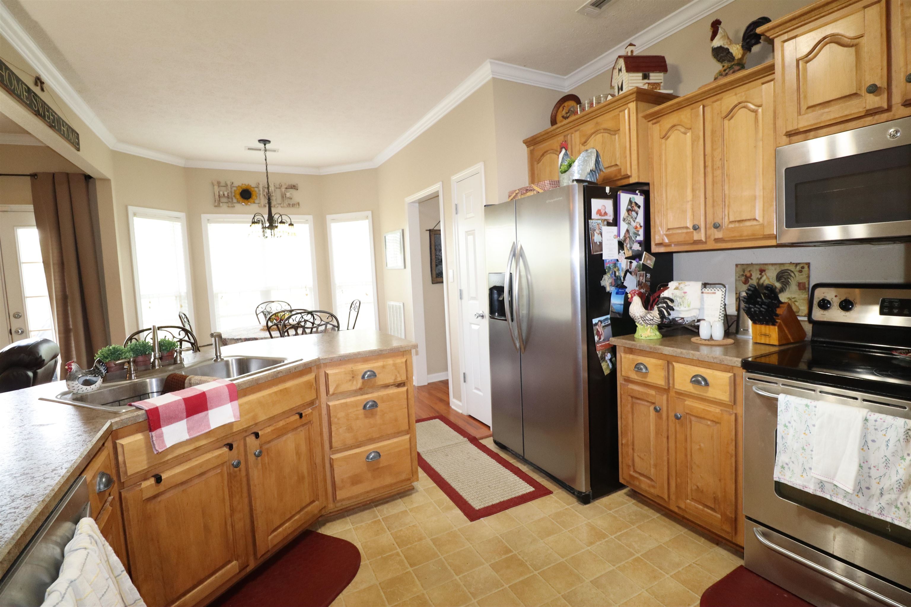 730 Durhamville Road Ripley, TN 38063 - Photo 16 of 40 a kitchen with stainless steel appliances granite countertop a refrigerator and a sink