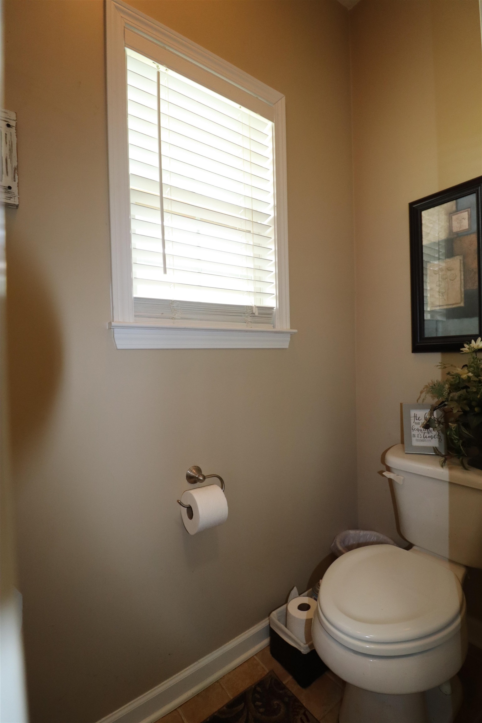 730 Durhamville Road Ripley, TN 38063 - Photo 19 of 40 a white toilet sitting next to a window in a bathroom