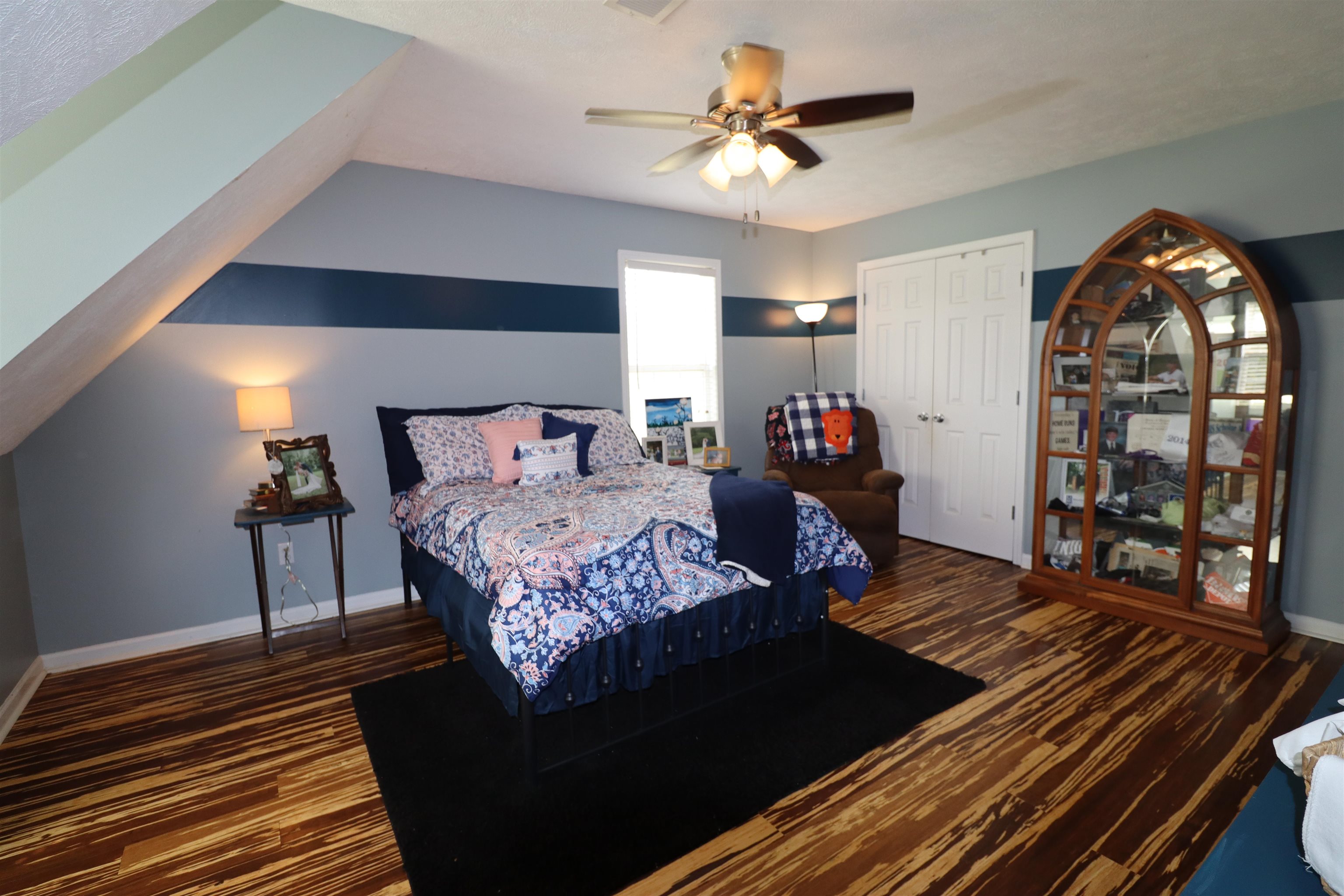 730 Durhamville Road Ripley, TN 38063 - Photo 22 of 40 a bedroom with a bed and wooden floor