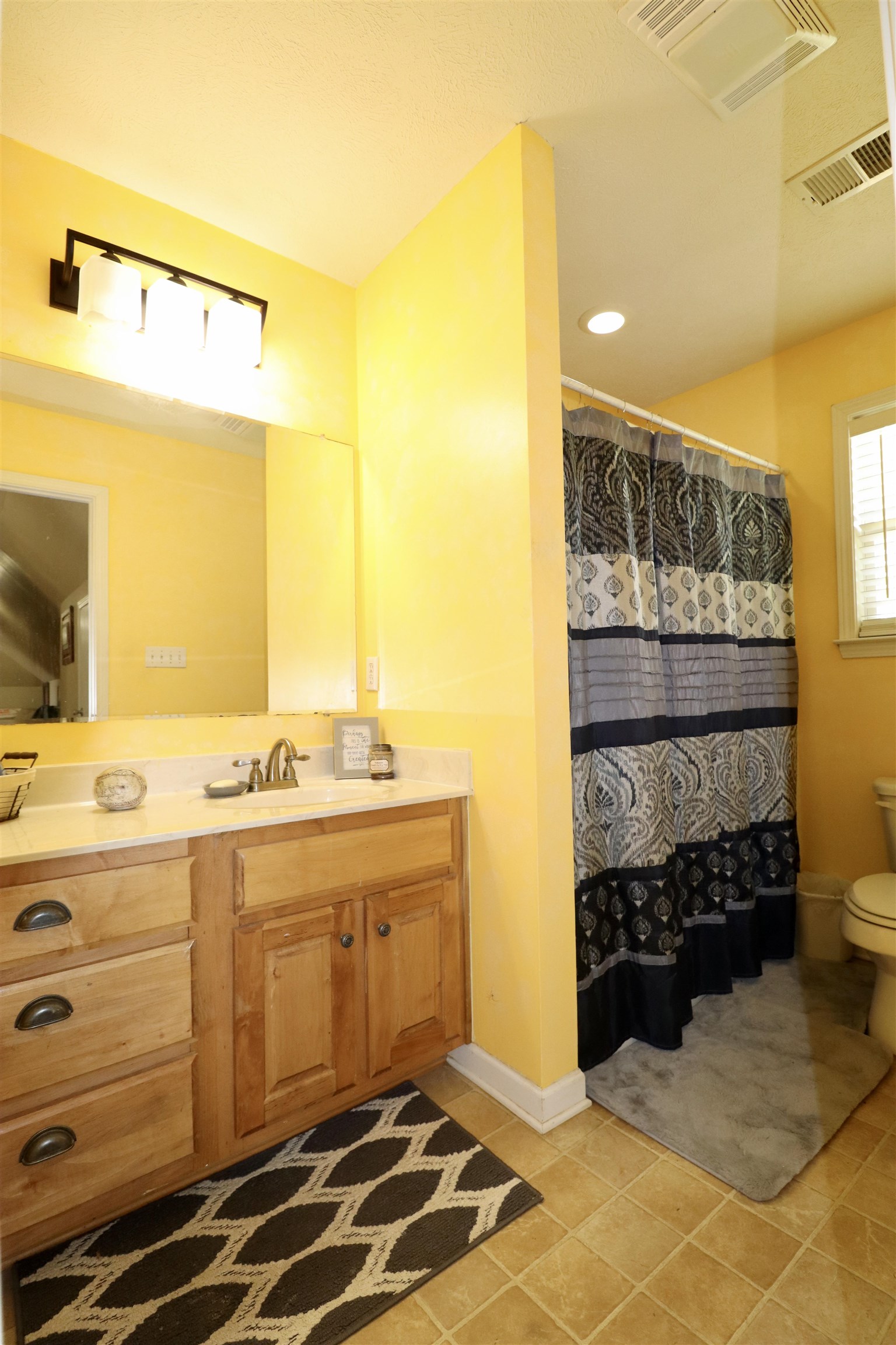 730 Durhamville Road Ripley, TN 38063 - Photo 23 of 40 a bathroom with a sink and a mirror