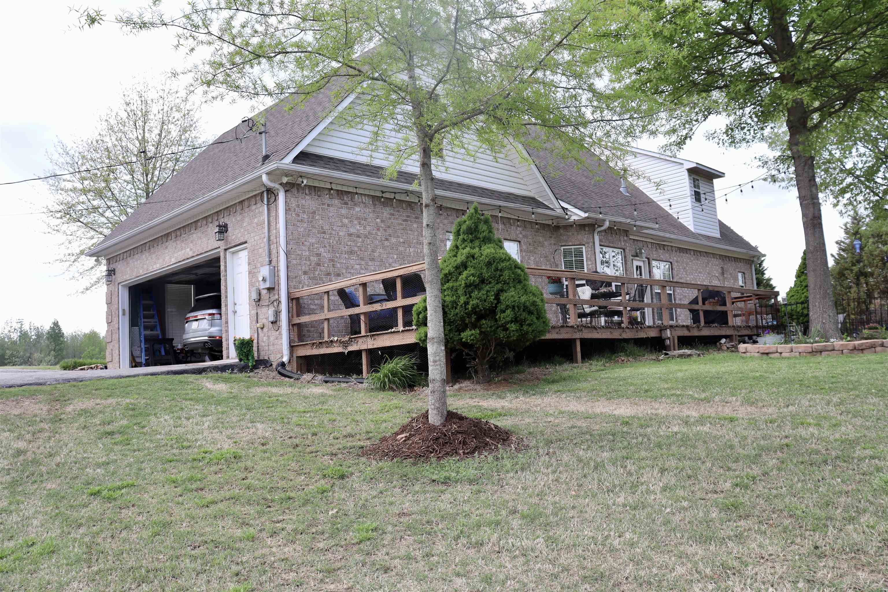 730 Durhamville Road Ripley, TN 38063 - Photo 31 of 40 a view of a house with a yard and a car park fire pit
