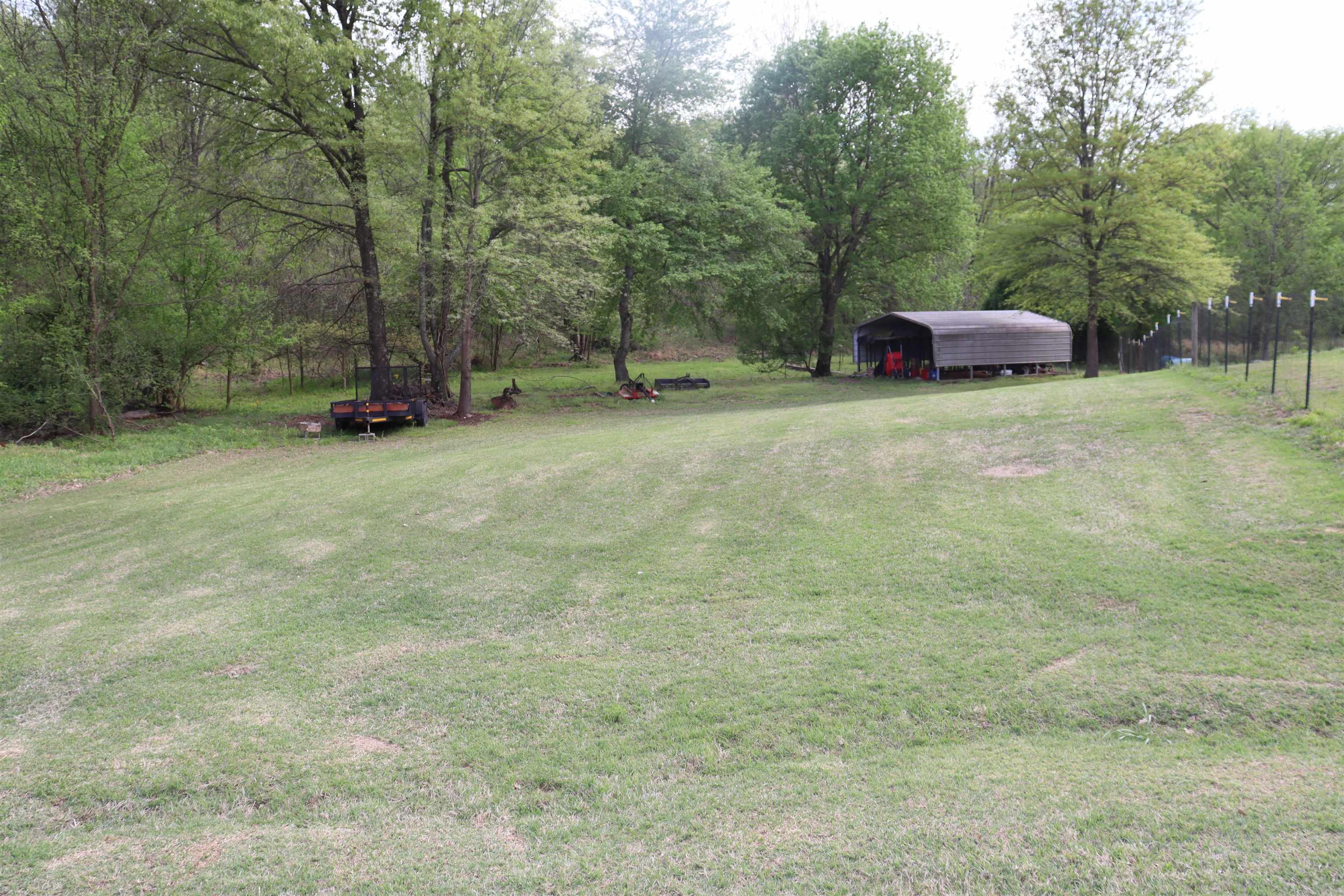 730 Durhamville Road Ripley, TN 38063 - Photo 39 of 40 a front view of a house with a yard and trees