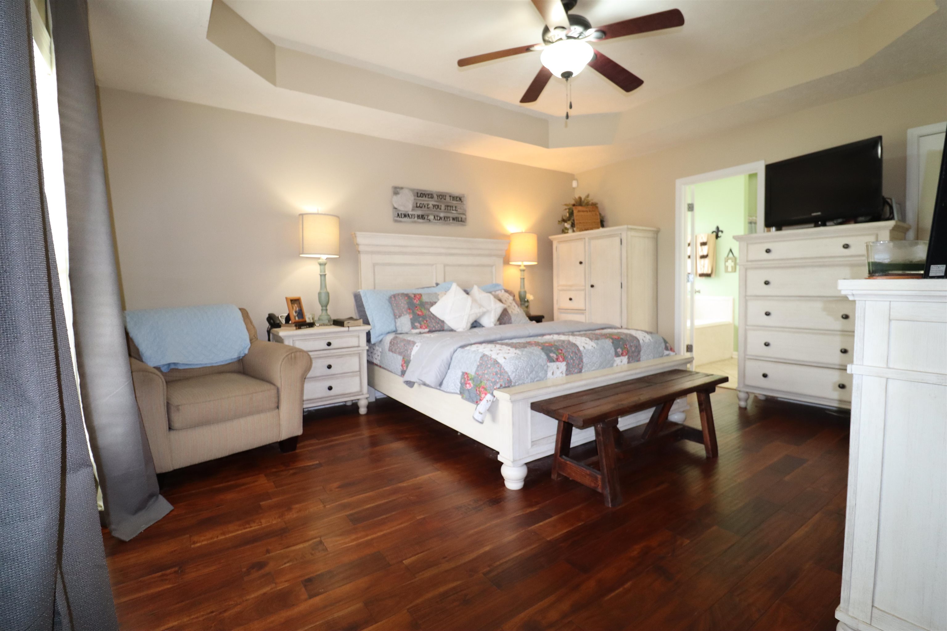 730 Durhamville Road Ripley, TN 38063 - Photo 5 of 40 a bedroom with furniture and a flat screen tv