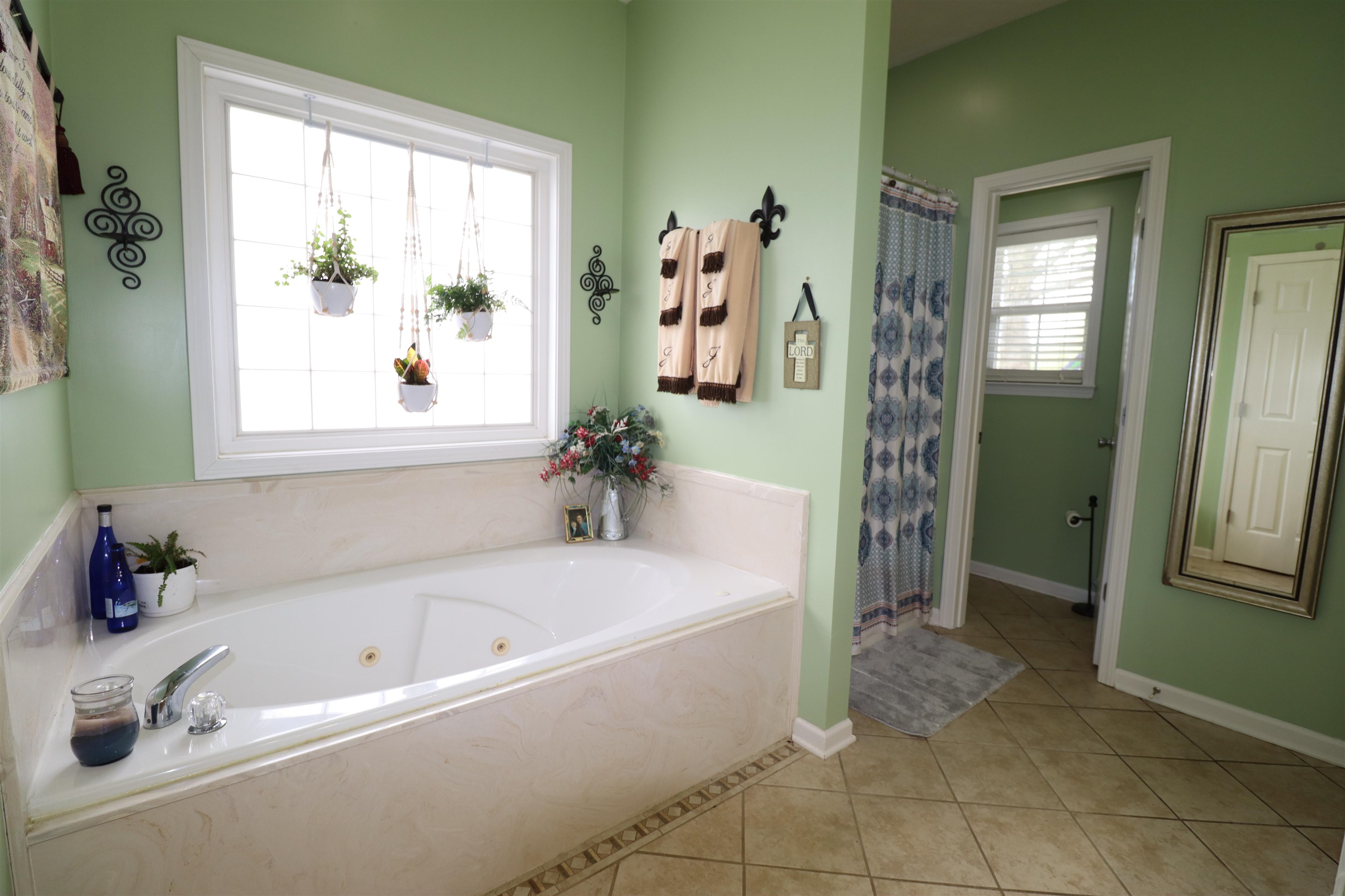 730 Durhamville Road Ripley, TN 38063 - Photo 9 of 40 a white bath tub sitting next to a bathroom sink