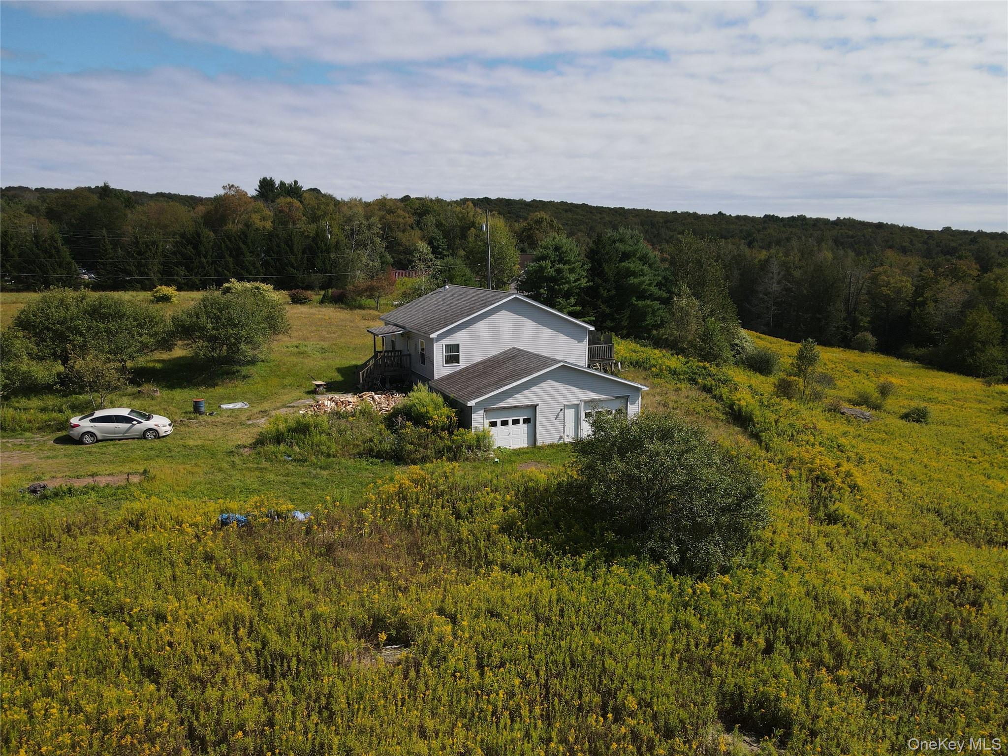 a view of a house with a yard