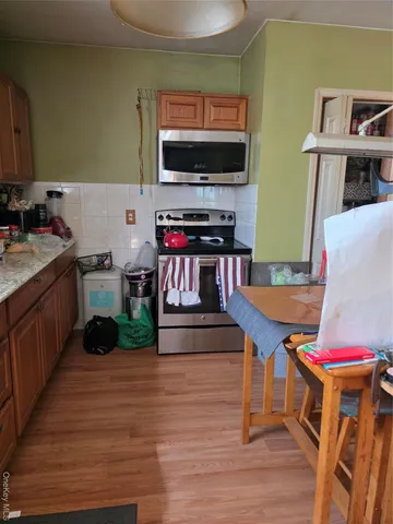 a living room with furniture a rug and a window
