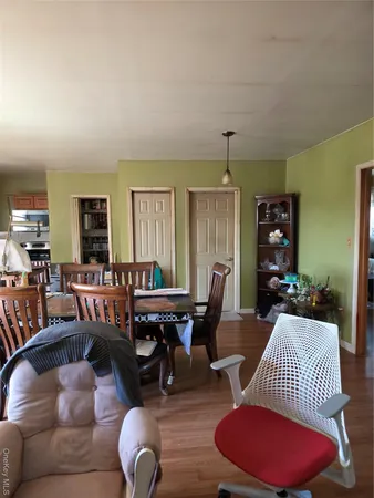 a kitchen with stainless steel appliances wooden cabinets and a large window