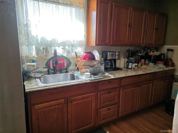 a bedroom with bed couch and window