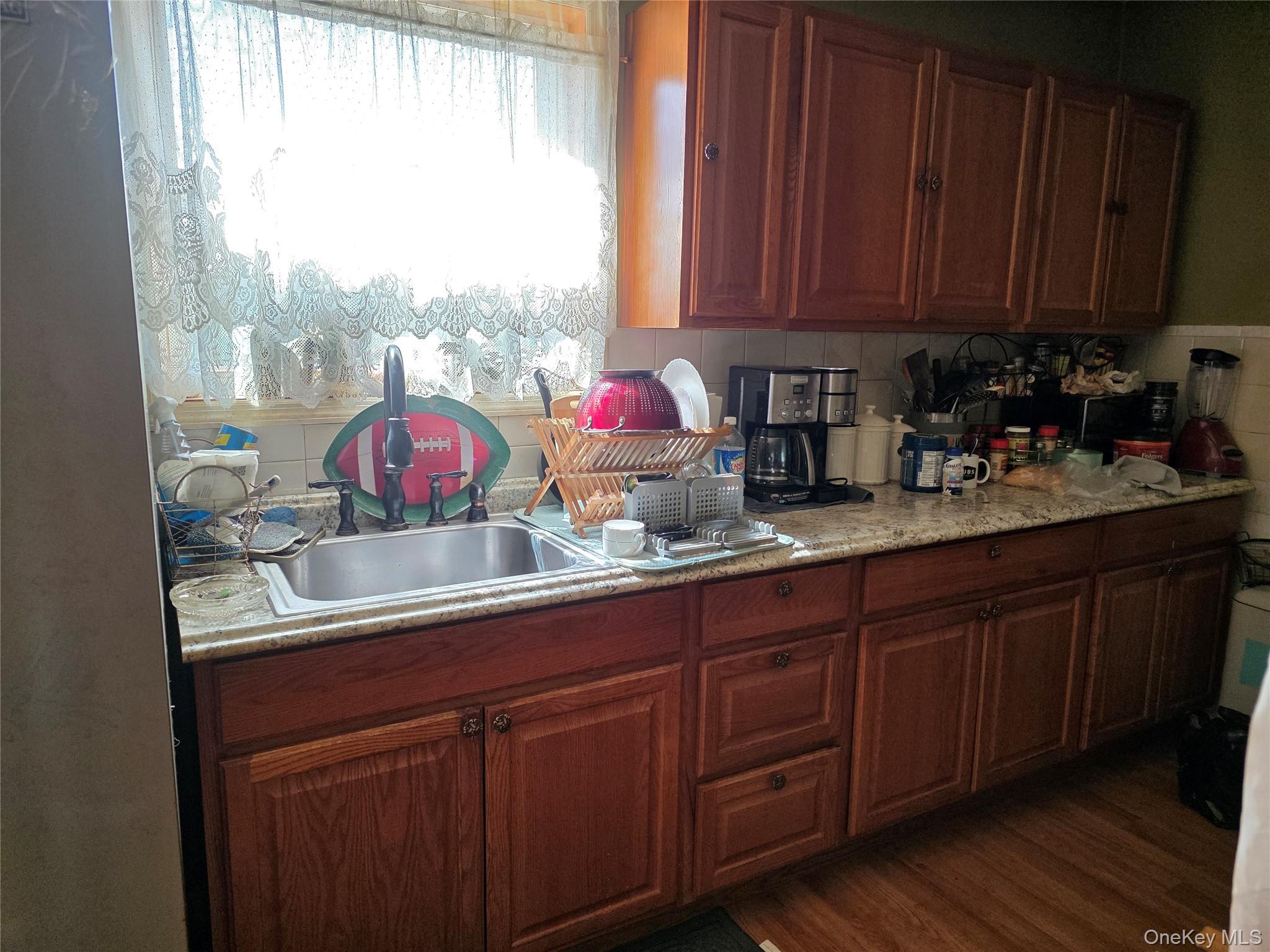 9 Queen Mountain Road, Unit 64 Ferndale, NY 12734 - Photo 13 of 20 a kitchen with stainless steel appliances wooden cabinets and a large window