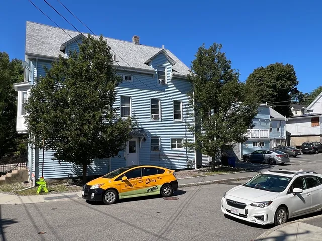 a car parked in front of a house