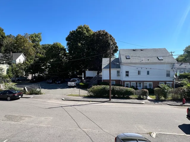 a city street lined with buildings and trees