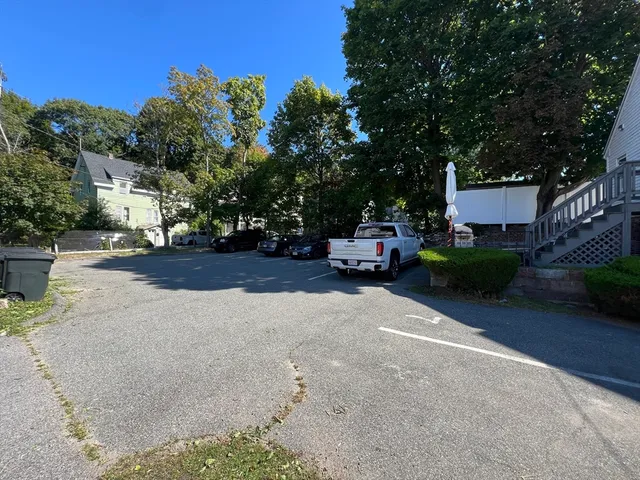 a view of street with parked cars