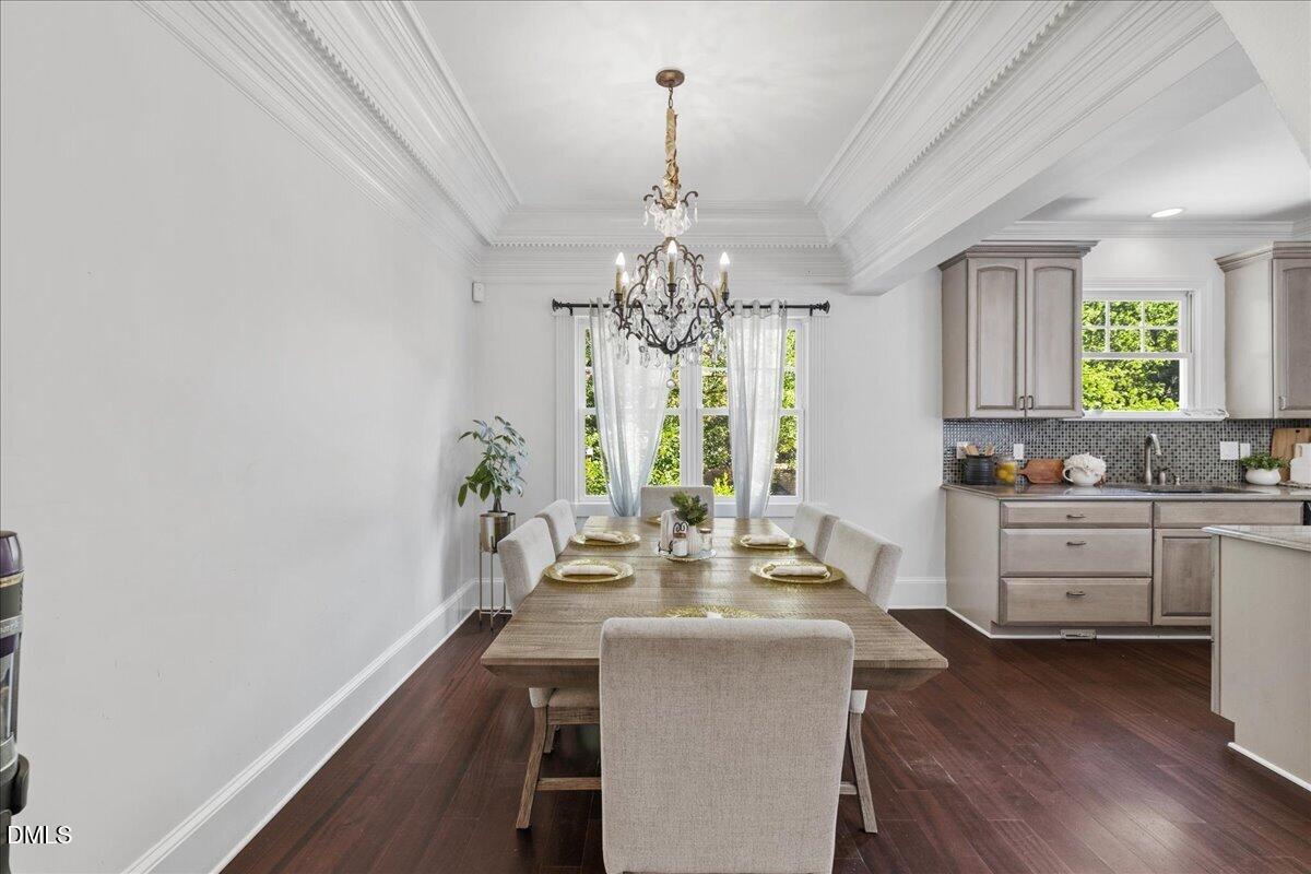 1304 Flying Hawk Road Apex, NC 27523 - Photo 9 of 52 a view of a dining room with furniture and window