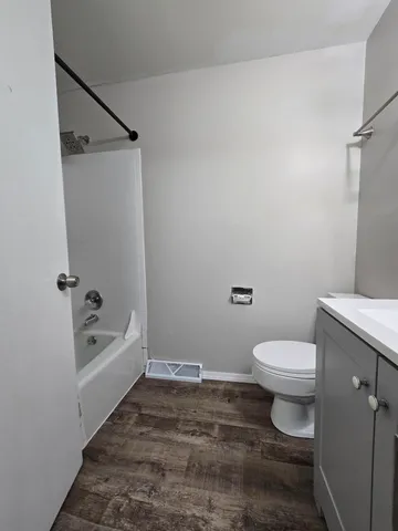 an empty room with a empty space and windows