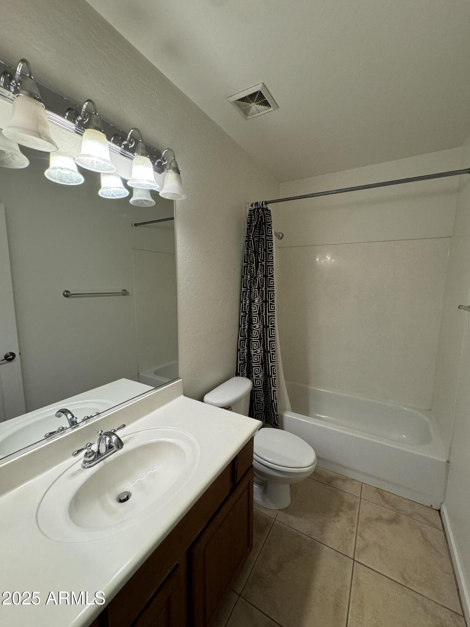 305 South Wilson Street, Unit 111 Tempe, AZ 85281 - Photo 17 of 48 a bathroom with a sink toilet and shower
