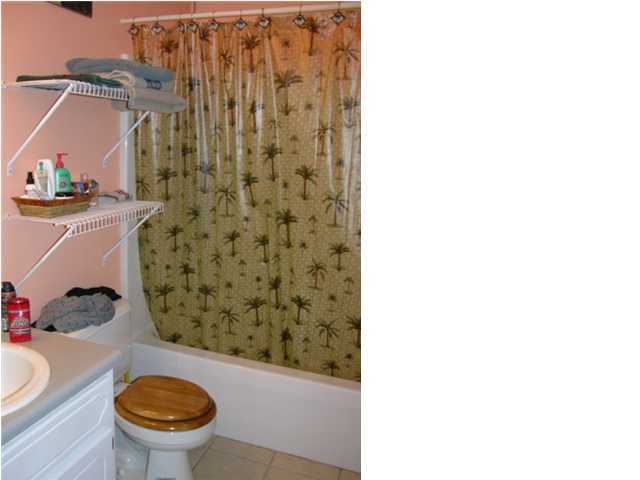 5865 Bush Road Baker, FL 32531 - Photo 17 of 32 a bathroom with a toilet and a shower