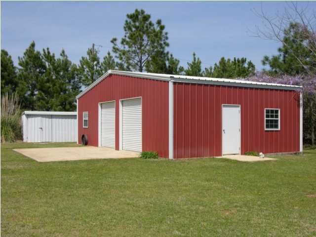 5865 Bush Road Baker, FL 32531 - Photo 2 of 32 a front view of a house with a garden