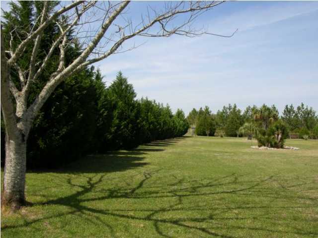 5865 Bush Road Baker, FL 32531 - Photo 21 of 32 a view of a field with trees in the background