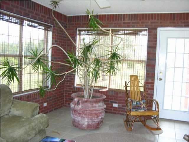 5865 Bush Road Baker, FL 32531 - Photo 10 of 32 a living room with furniture and large windows
