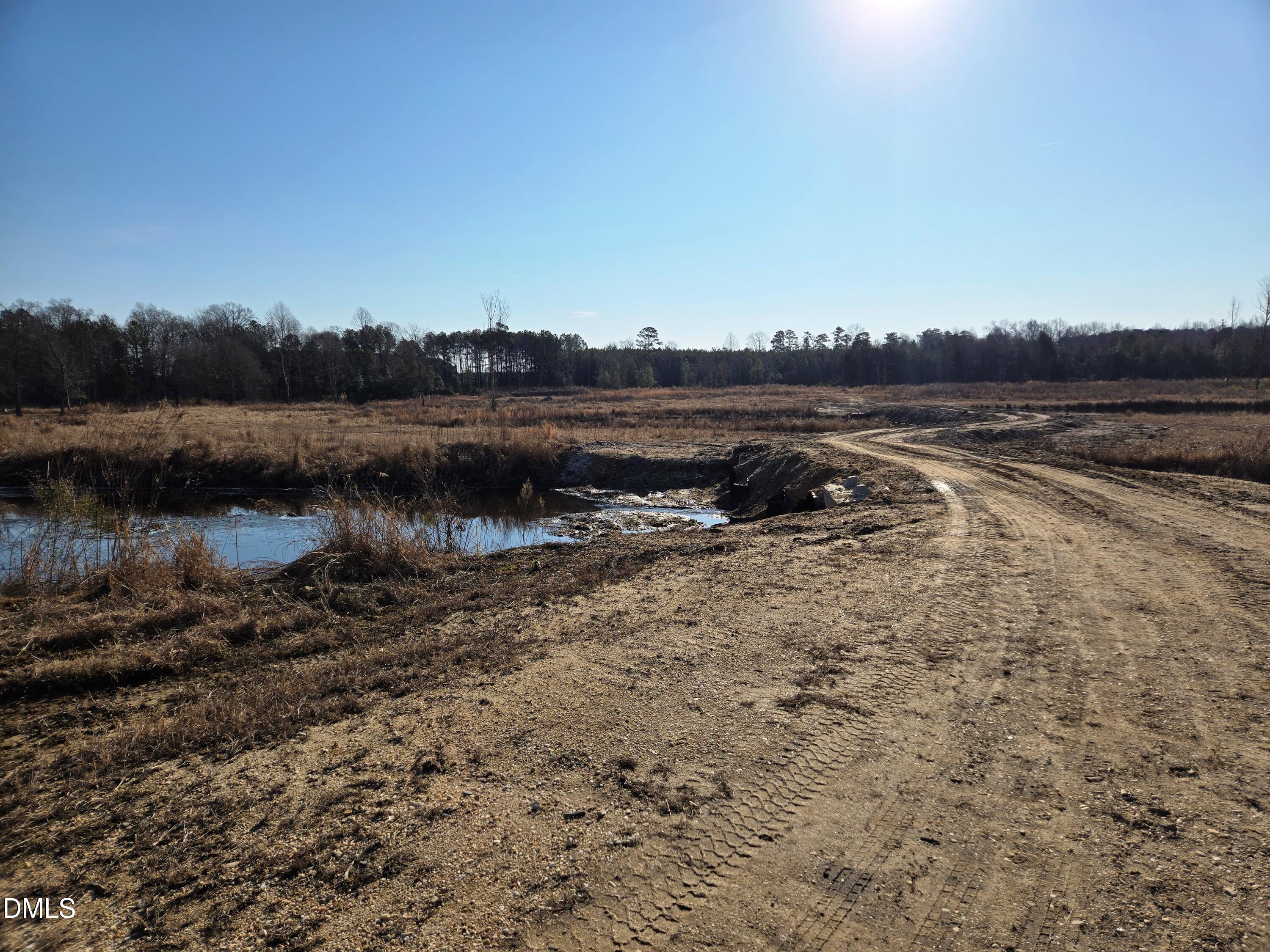 0 Mamie Upchurch Road Lillington, NC 27546 - Photo 10 of 13 a view of a lake with an outdoor space