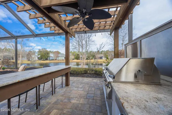 a kitchen with stainless steel appliances granite countertop a stove and a sink