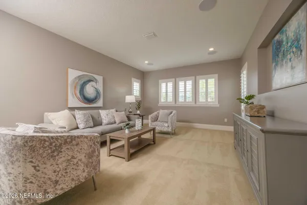 a row of palm trees and swimming pool in the backyard of a house