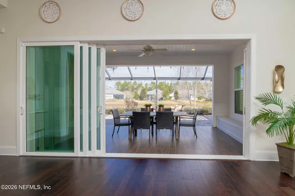 a view of walk in closet with wooden floor