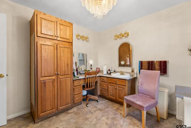 a room with furniture a rug and a window