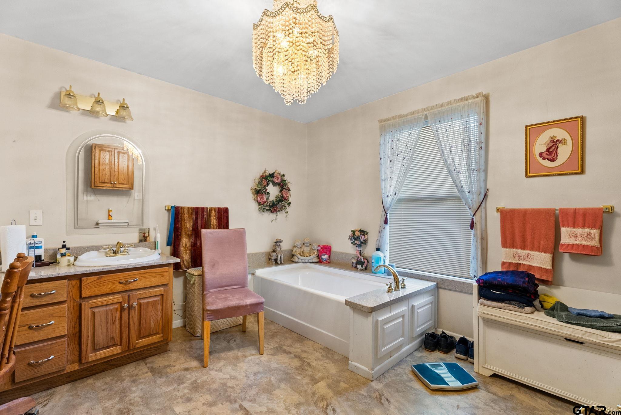 203 Pecan Street Rusk, TX 75785 - Photo 15 of 35 a bathroom with a sink mirror and vanity