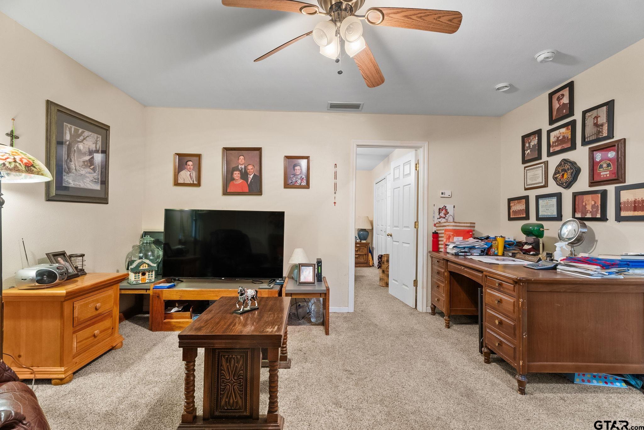 203 Pecan Street Rusk, TX 75785 - Photo 20 of 35 a room with furniture and flat screen tv