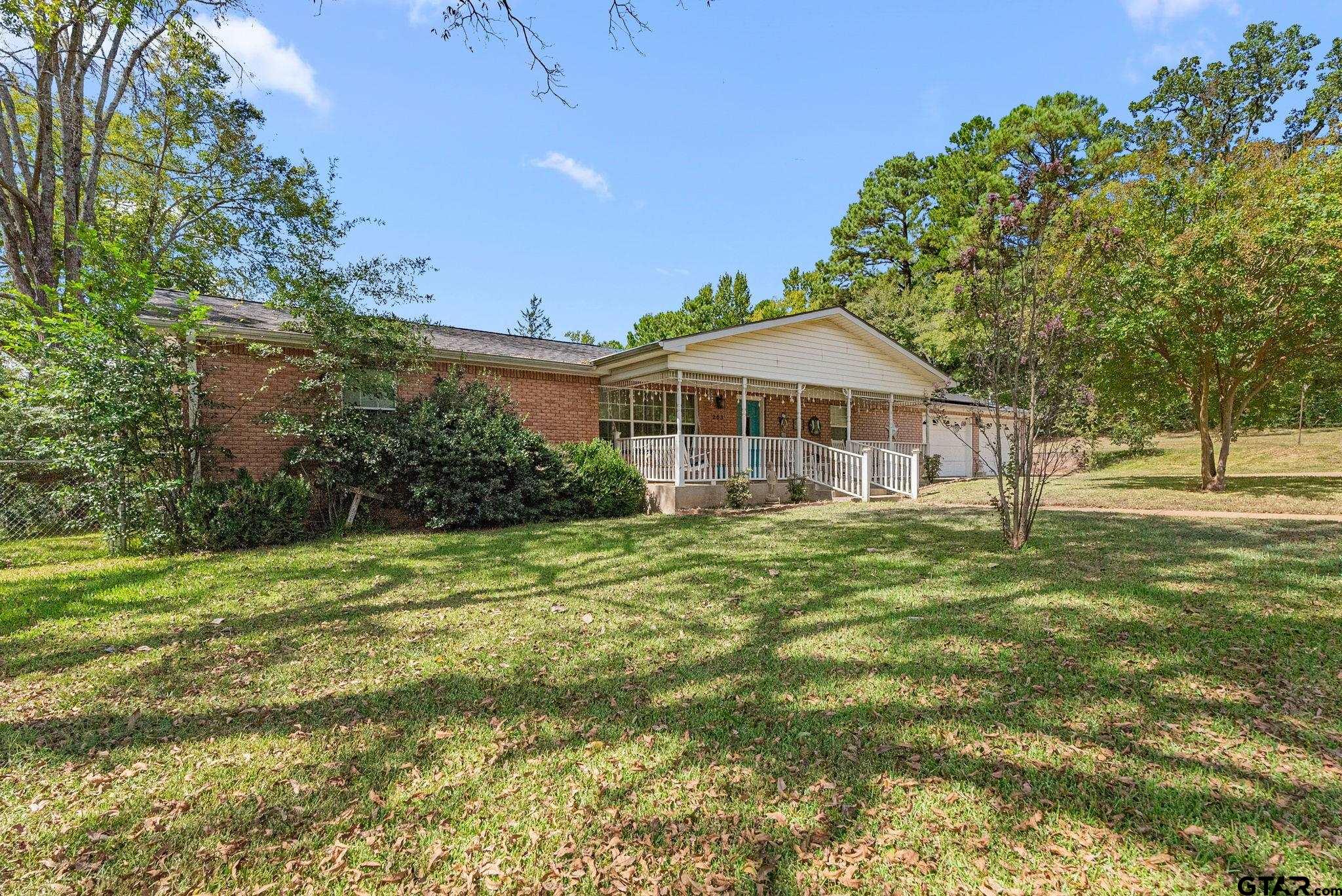 203 Pecan Street Rusk, TX 75785 - Photo 2 of 35 a front view of a house with a yard