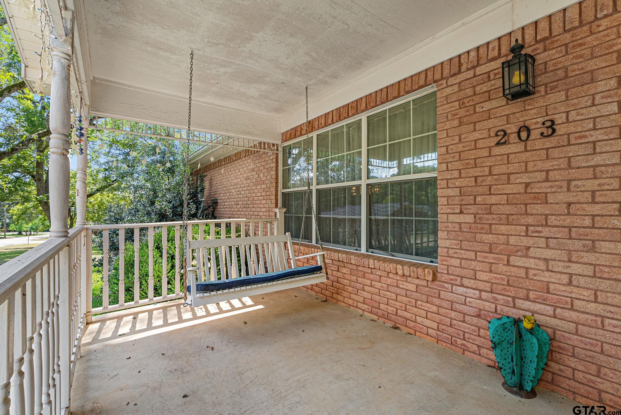 203 Pecan Street Rusk, TX 75785 - Photo 25 of 35 a view of a chair and table in the balcony