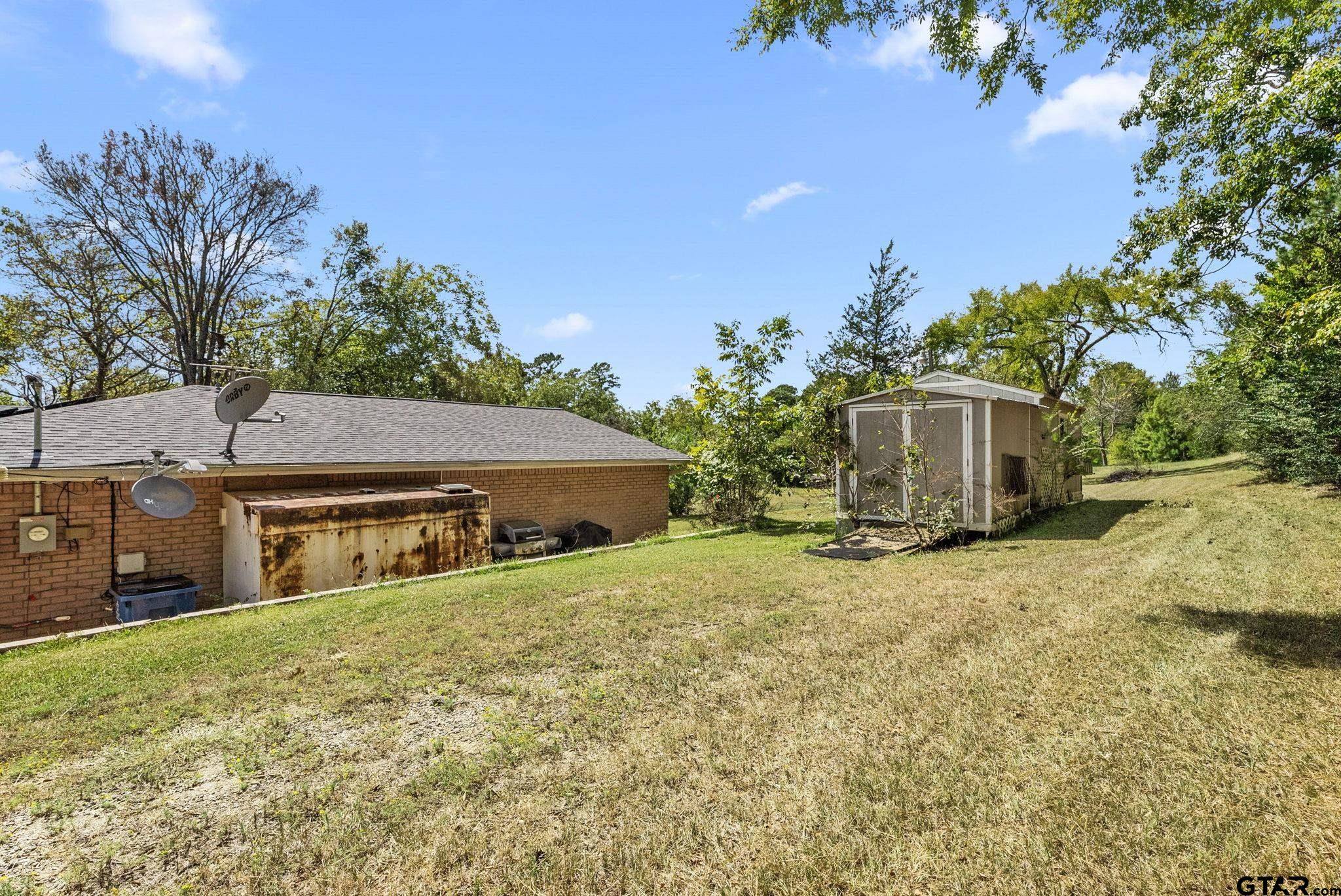 203 Pecan Street Rusk, TX 75785 - Photo 27 of 35 a house with trees in front of it