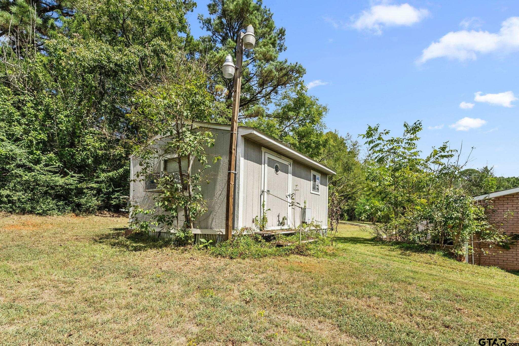 203 Pecan Street Rusk, TX 75785 - Photo 28 of 35 a house with trees in front of it