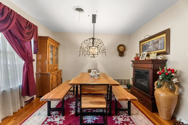 a dining room with furniture and window