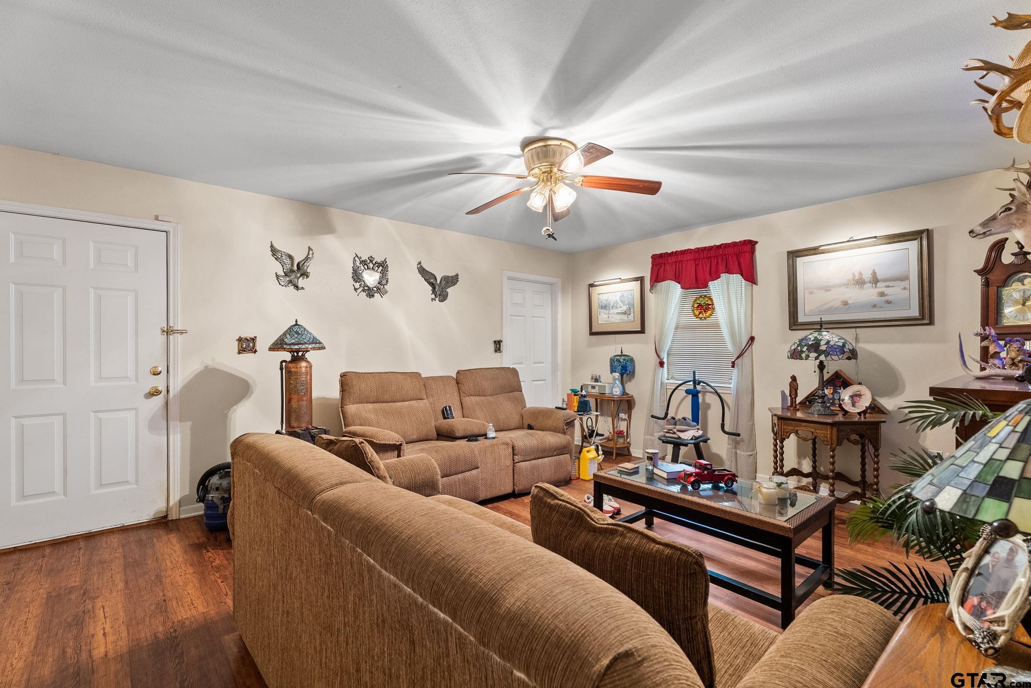 203 Pecan Street Rusk, TX 75785 - Photo 9 of 35 a living room with furniture kitchen view and a window
