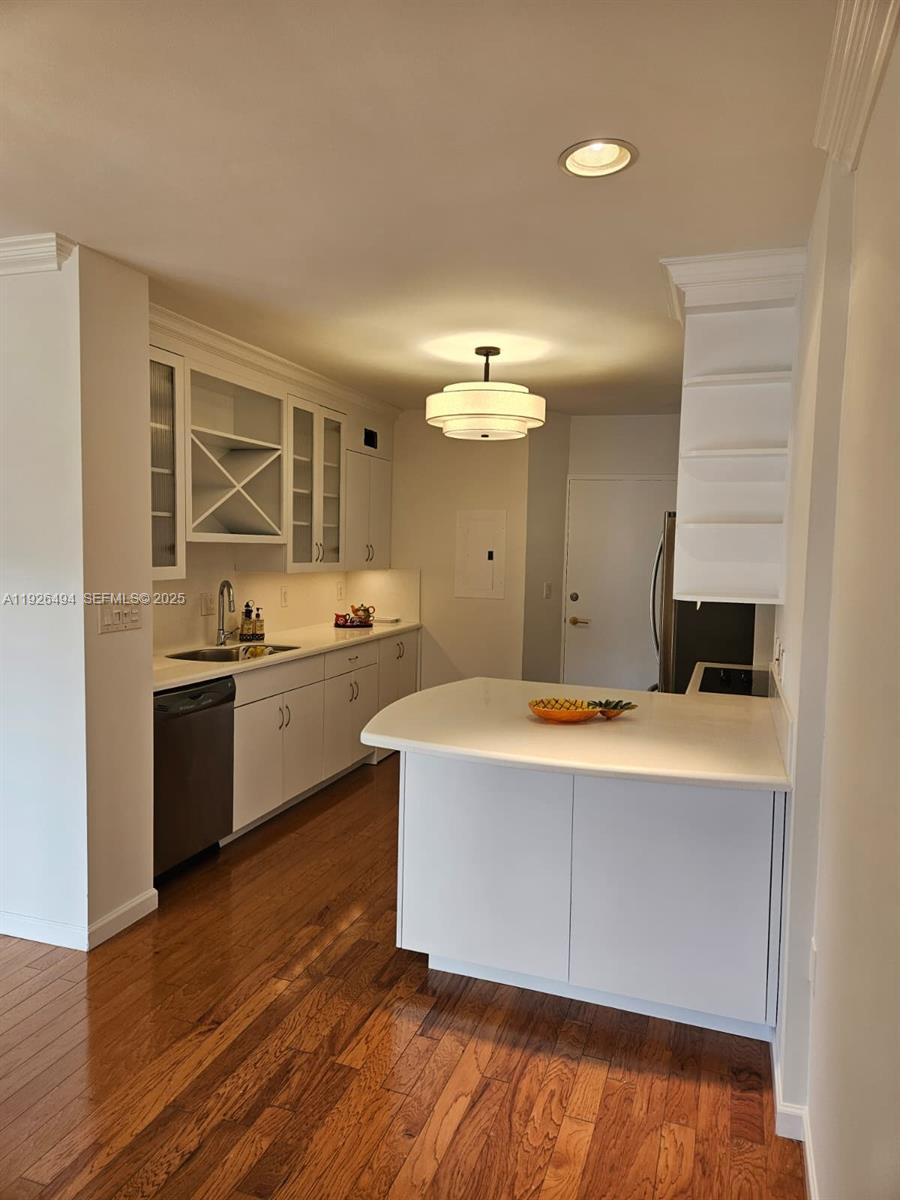 44 Cocoanut Row, Unit 306A Palm Beach, FL 33480 - Photo 5 of 11 a large kitchen with kitchen island a sink a stove and white cabinets